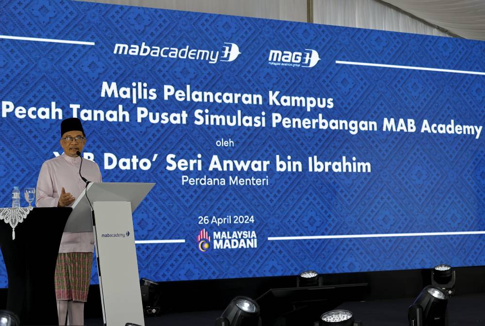 Prime Minister Datuk Seri Anwar Ibrahim delivering his speech at the launching of the Malaysia Airlines Academy and the groundbreaking ceremony of its Flight Simulator Building today. - Photo by Bernama