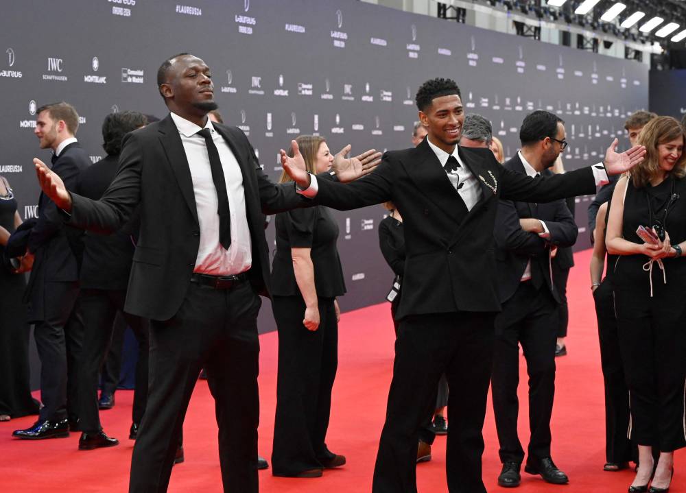 Jamaican sprinter Usain Bolt and Real Madrid's English midfielder Jude Bellingham (R) pose on the Red Carpet ahead of the 25th Laureus World Sports Awards gala in Madrid on April 22, 2024. (Photo by AFP)