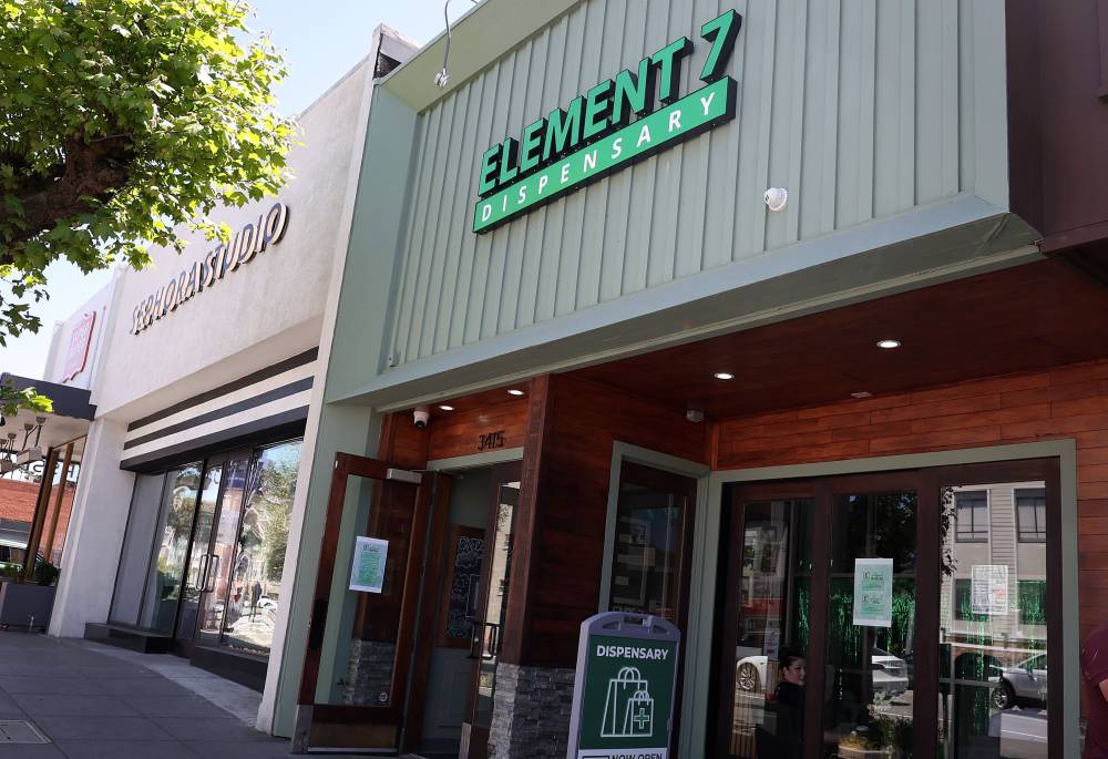 A sign is posted in front of a cannabis dispensary on April 30, 2024 in San Francisco, California. - Photo by AFP