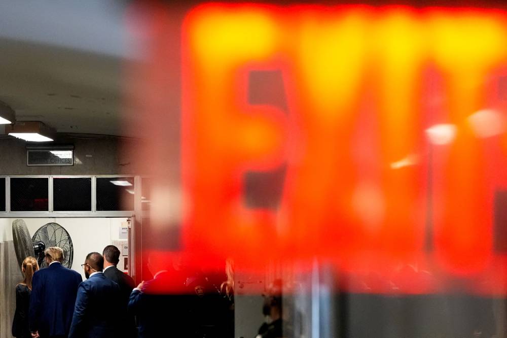 Former US President Donald Trump (L) departs the courtroom for a lunch break during his trial for allegedly covering up hush money payments linked to extramarital affairs, at Manhattan Criminal Court in New York City, on May 6, 2024. - Photo by AFP