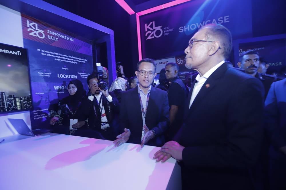 Mranti Chief Investment Officer Khairil Anuar Sadat Salleh with Prime Minister Datuk Seri Anwar Ibrahim at the KLIB booth during the launch of KL20 event on Tuesday.