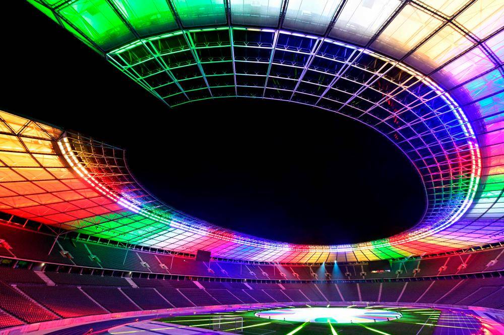 In this file photo taken on October 5, 2021 the Olympic stadium is lit up with the colors of the new UEFA Euro 2024 football championship logo, presented at the Olympic stadium in Berlin. - File photo by AFP
