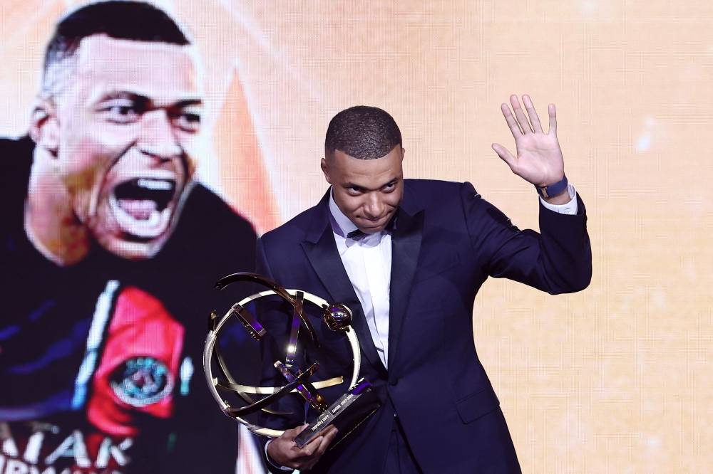 Paris Saint-Germain's French forward #07 Kylian Mbappe waves as he delivers a speech after receiving the Best Players Ligue 1 Award at the end of the TV show at the UNFP (French National Professional Football players Union) trophy ceremony, in Paris on May 13, 2024. (Photo by AFP)