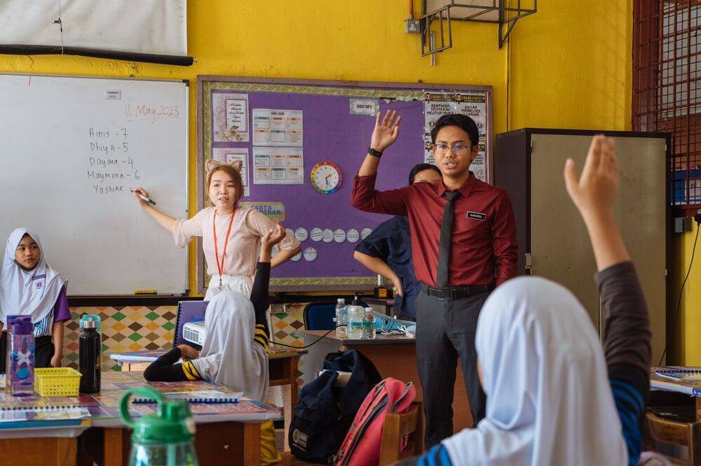Qamarul Azarin teaching his students at Sekolah Kebangsaan Landeh, Kuching, Sarawak.
