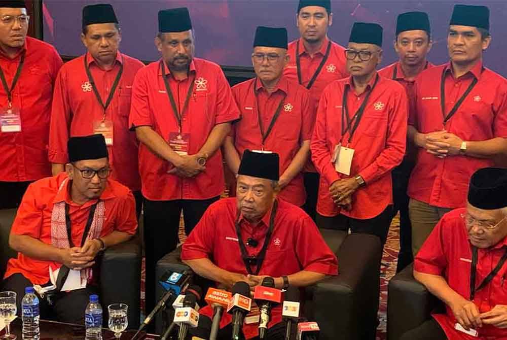 Muhyiddin (seated, centre) at a press conference after the Bersatu 2024 Special General Assembly. FILE PIX