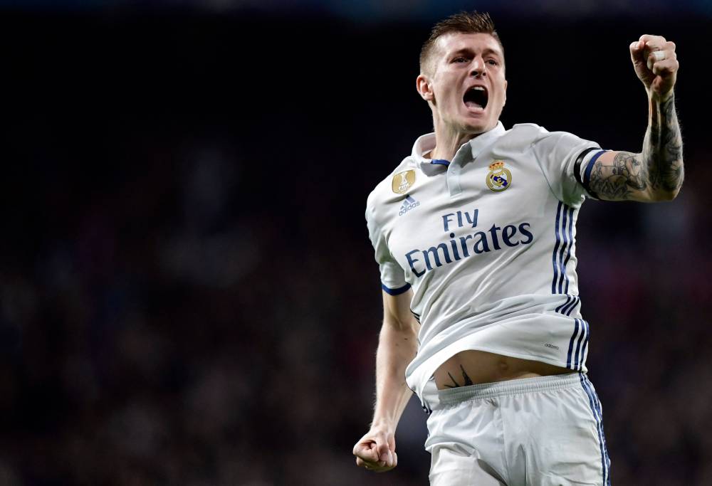 Real Madrid's German midfielder Toni Kroos celebrates a goal during the UEFA Champions League round of 16 first leg football match Real Madrid CF vs SSC Napoli at the Santiago Bernabeu stadium in Madrid on February 15, 2017. - File photo by AFP