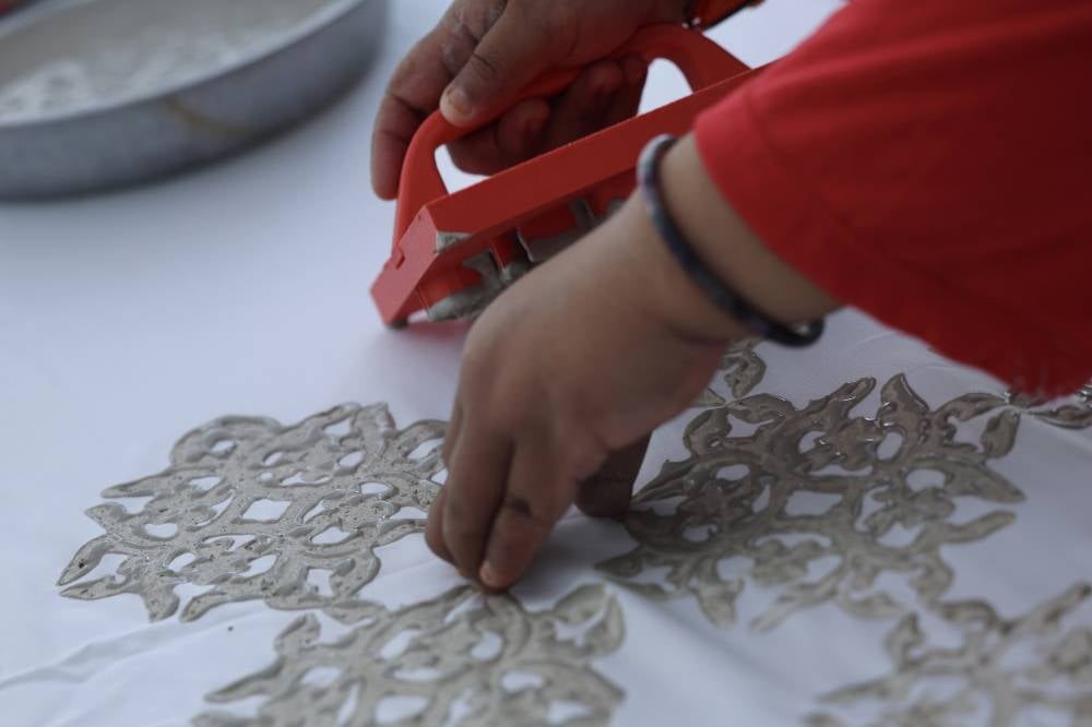 A former student said she started making batik using the clay resist technique after she accepted an offer from Kraftangan Malaysia to join their incubator entrepreneur programme in 2021. - Photo by Bernama