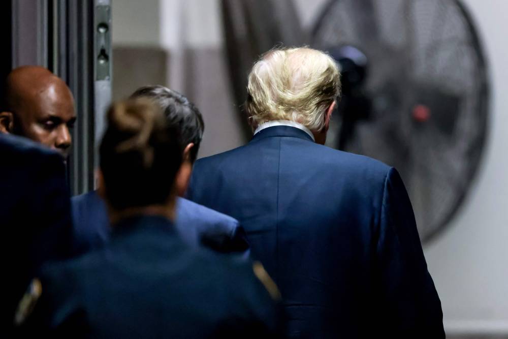 Former US President and Republican presidential candidate Donald Trump leaves the courthouse after he was convicted in his criminal trial at Manhattan Criminal Court in New York City, on May 30, 2024. - Photo by AFP