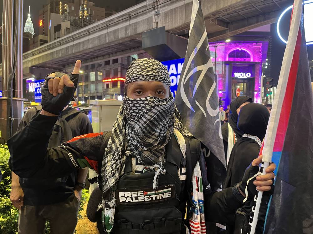 One of the rally participant, Mikael Abdullah present to express his solidarity with Palestine.