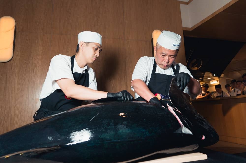 Nobu Corporate Sushi Chef, Chef Toshiyuki Shiramizu cutting off the Bluefin Tuna assisted by Nobu KL Chef 