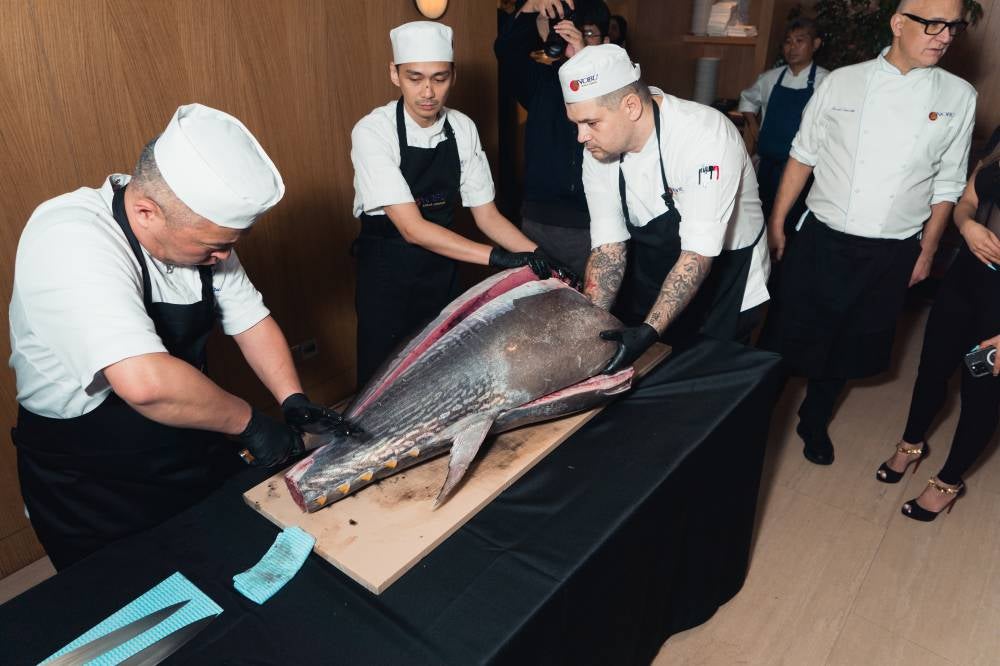Nobu Corporate Sushi Chef, Chef Toshiyuki Shiramizu cutting off the Bluefin Tuna assisted by Nobu KL Chef 