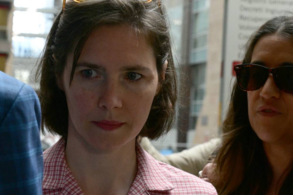 US Amanda Knox arrives at the courthouse in Florence, on June 5, 2024 before a hearing in a slander case, related to her jailing and later acquittal for the murder of her British roommate in 2007. - (Photo by TIZIANA FABI / AFP)