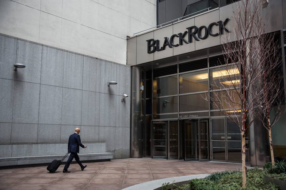A man walks into the BlackRock offices on Jan 16, 2014 in New York City. - Photo by AFP