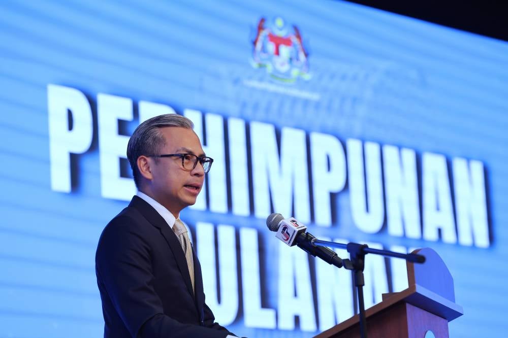 Communications Minister Fahmi Fadzil delivering his speech at the ministry’s monthly assembly in Putrajaya today. - Photo by Bernama