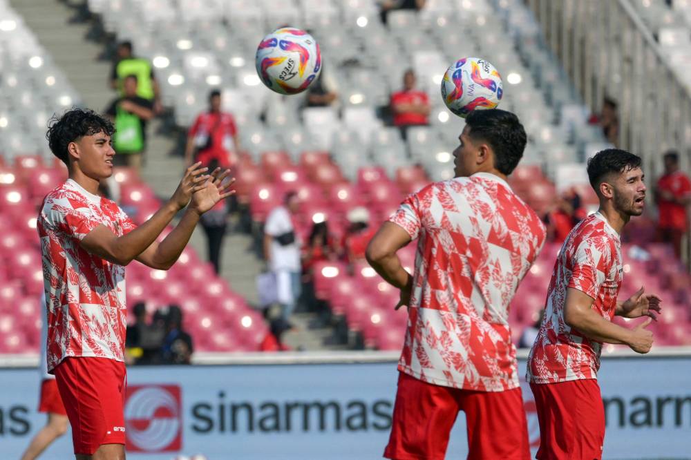 Indonesia's players warm up before the 2026 FIFA World Cup Asian qualification football match between Indonesia and Iraq at Bung Karno stadium in Jakarta on June 6, 2024. (Photo by AFP)