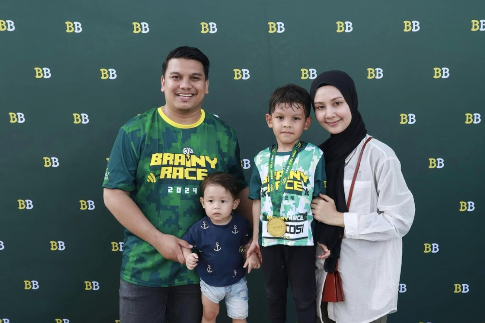 Amirul Aizzat with his family.