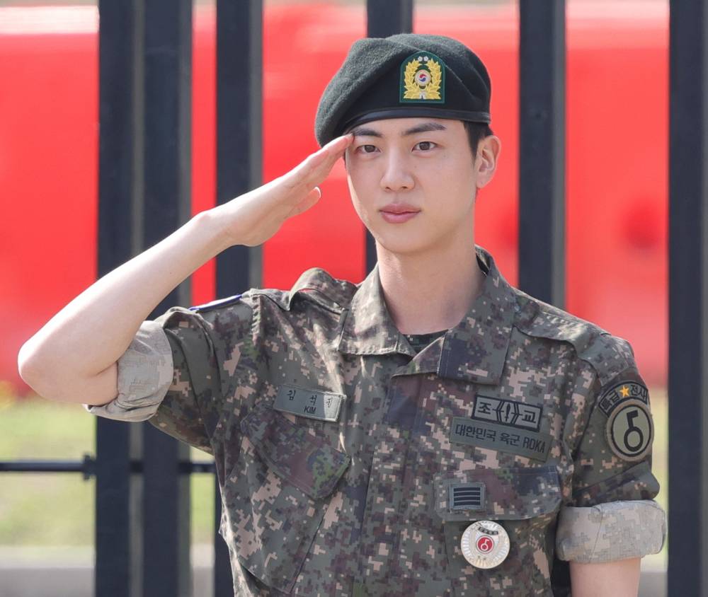 BTS member Jin salutes at the Army's 5th Infantry Division after completing his 18 months of mandatory military service in Yeoncheon, 61 kilometers north of Seoul, South Korea, 12 June 2024. (EPA/YONHAP)