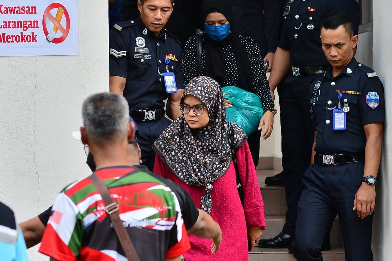 Zayn Rayyan's parents, Ismanira (left) and Zaim Ikhwan, were released after posting bail and were seen leaving the court at the Petaling Jaya Court Complex on Thursday. Photo: Asril Aswandi Shukor/Sinar Harian