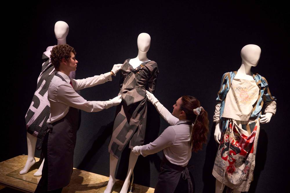 Gallery assistants pose with creations by late British designer Vivienne Westwood during a photocall for the "Vivienne Westwood: The Personal Collection" auction at Christie's auction house in London. Photo by Benjamin Cremel/AFP