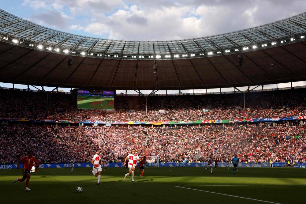 (From L) Spain's forward #19 Lamine Yamal, Croatia's defender #04 Josko Gvardiol and Croatia's defender #03 Marin Pongracic run for the ball during the UEFA Euro 2024 Group B football match between Spain and Croatia at the Olympiastadion in Berlin on June 15, 2024. (Photo by Odd ANDERSEN / AFP)