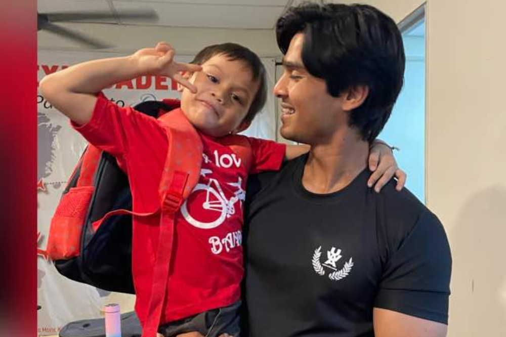 Rahman with one of his students.