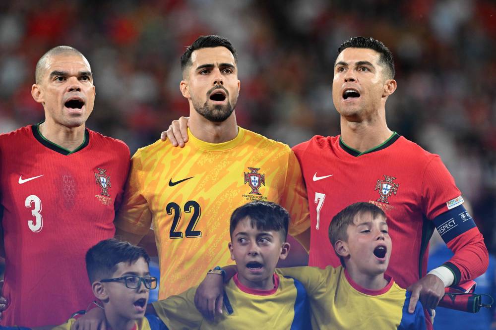 (L-R) Portugal's defender #03 Pepe, Portugal's goalkeeper #22 Diogo Costa and Portugal's forward #07 Cristiano Ronaldo sing during the anthems ahead of kick-off in the UEFA Euro 2024 Group F football match between Portugal and the Czech Republic at the Leipzig Stadium in Leipzig on June 18, 2024. (Photo by AFP)