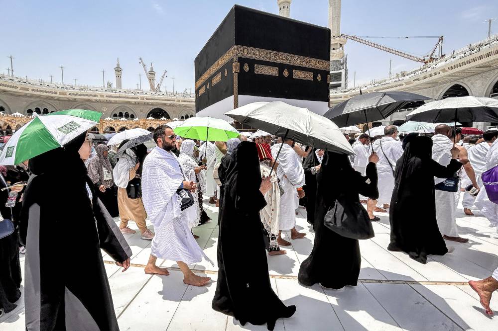 Muslim devotees walk around the Kaaba, Islam's holiest shrine, at the Grand Mosque in Saudi Arabia's holy city of Mecca on June 13, 2024, ahead of the annual Haj pilgrimage. Friends and family searched for missing hajj pilgrims on June 19 as the death toll at the annual rituals, which were carried out in scorching heat, surged past 900. - (Photo by FADEL SENNA / AFP)