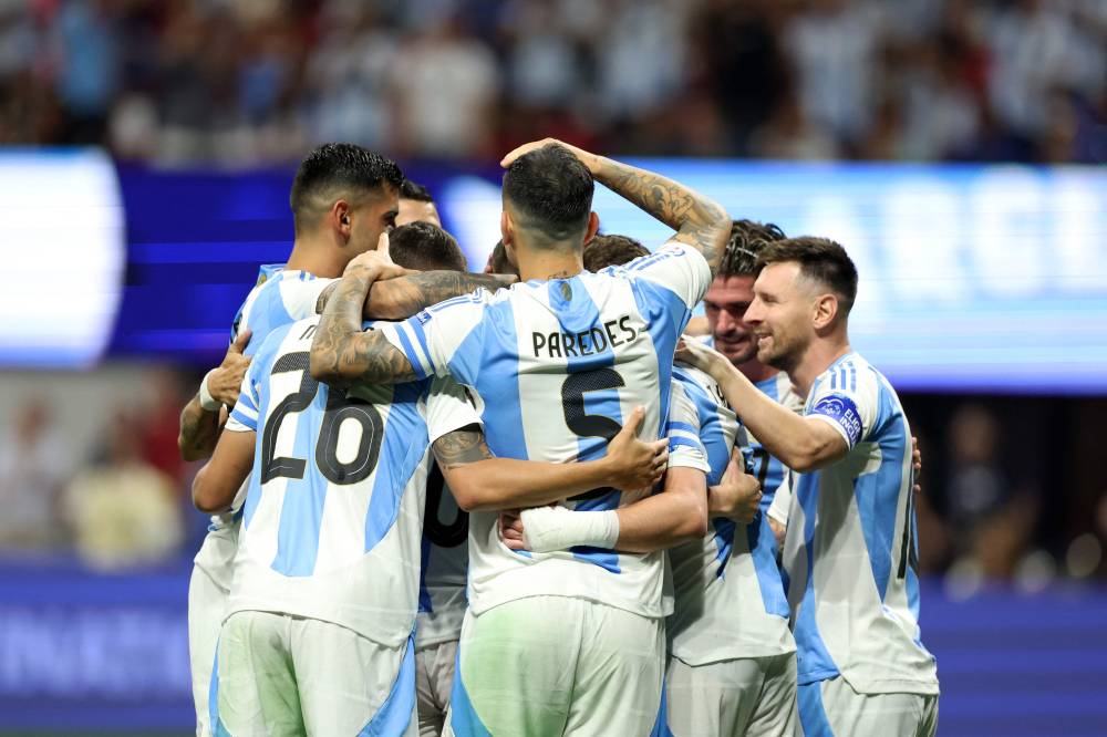 Argentina's forward #09 Julian Alvarez (3rd R) celebrates scoring his team's first goal with Argentina's forward #10 Lionel Messi (R) Argentina's defender #26 Nahuel Molina Lucero and Argentina's forward #05 Leandro Paredes. Photo by AFP