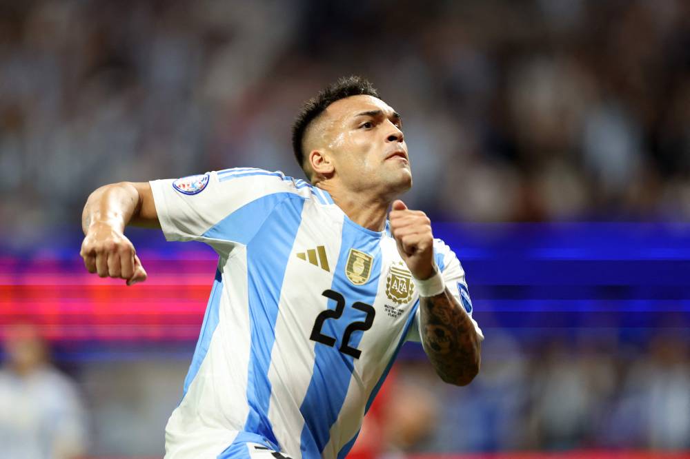 Argentina's forward #22 Lautaro Martinez celebrates scoring his team's second goal. Photo by AFP