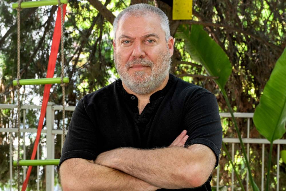 Gonen Ben Yitzhak, former agent of the Israel Security Agency (Shabak or Shin Bet) and a current activist against incumbent Israeli Prime Minister Benjamin Netanyahu, poses during an interview at his home in Modiin in central Israel on June 22, 2024. - Photo by AFP