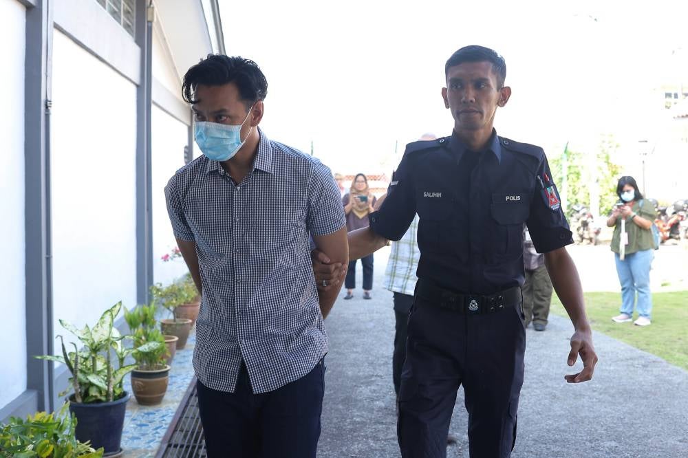 Technician Mohd Ridwan Mat Nasir, 37, who went viral for allegedly beating up his wife at a hotel in PD last month, was charged at the Magistrate’s Court today. - Photo by Bernama