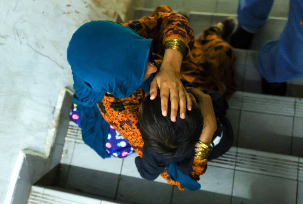 The raid also successfully uncovered a passport forgery syndicate operating under the guise of laundry shops, telecommunication stores and barber shops. - Photo by Bernama