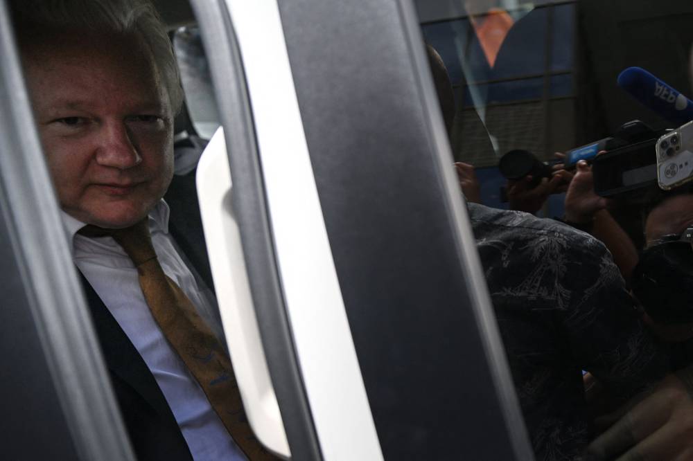 WikiLeaks founder Julian Assange sits in a vehicle as he leaves the US Federal Courthouse in the Commonwealth of the Northern Mariana Islands in Saipan, Northern Mariana Islands, on June 26, 2024.- Photo by AFP