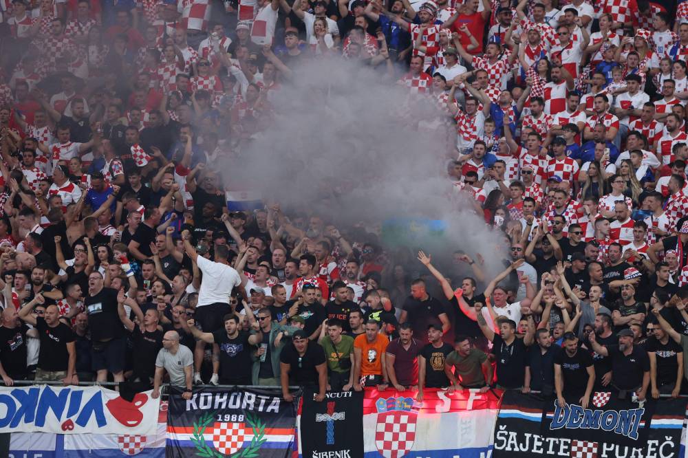 Croatia's fans cheer on their team during the UEFA Euro 2024 Group B football match between the Croatia and Italy at the Leipzig Stadium in Leipzig on June 24, 2024. (Photo by Ronny AFP)
