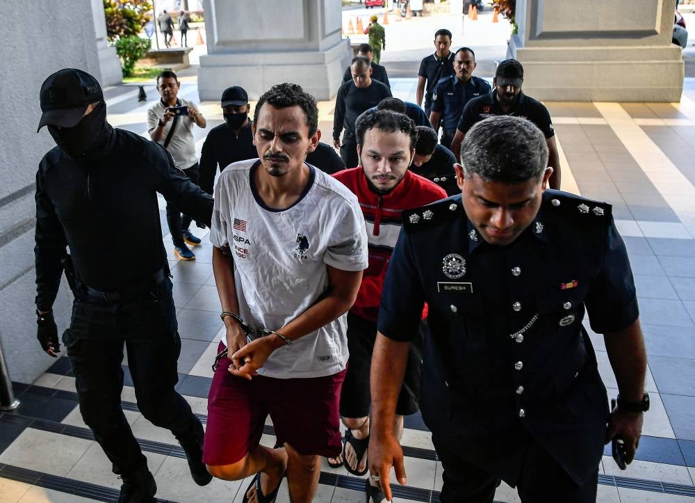 Two Colombian men pleaded not guilty at the Kuala Lumpur Sessions Court today to charges of breaking into a businessman's house and stealing RM7 million in valuables last month. - Photo by Bernama