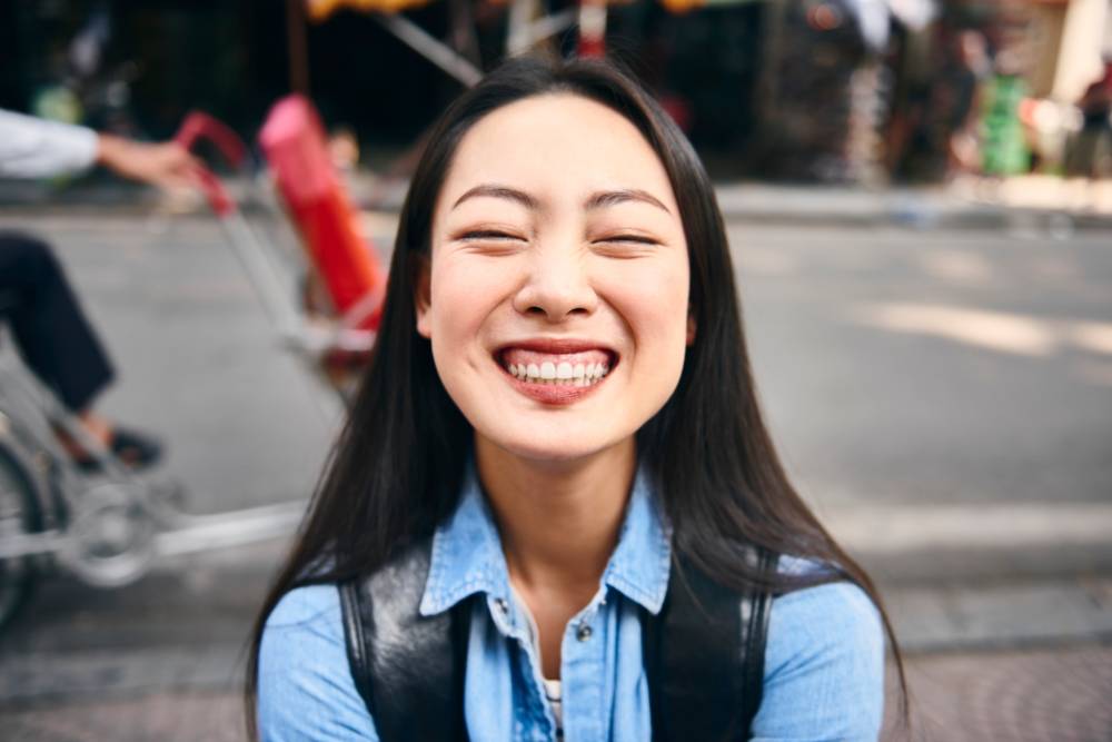 Nine in 10 adults in Indonesia (90%) said they smiled or laughed a lot the day before the survey. Photo for illustrative purposes only - 123RF