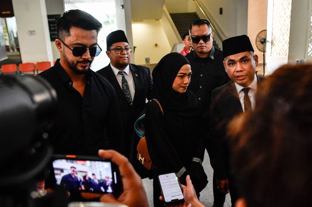 Singer and actor Aliff Aziz (left) and actress Ruhainies (three, left) at the Kuala Lumpur Syariah Courts Complex, today. - Photo by Bernama