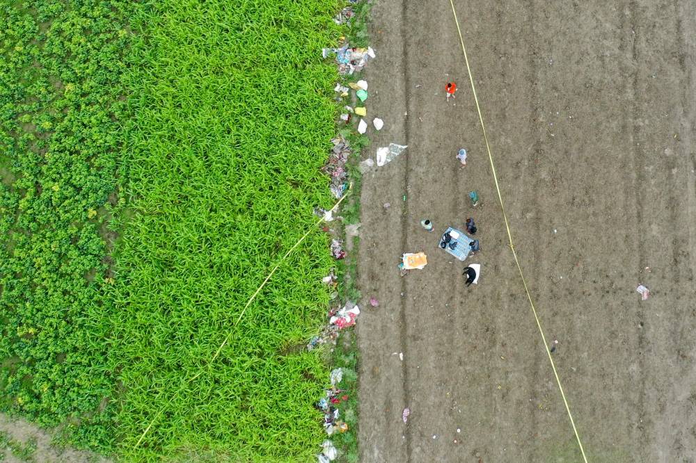Forensic experts inspect the stampede site that killed people during a sermon at Hathras in India's Uttar Pradesh state on July 3, 2024. Survivors of India's deadliest stampede in over a decade on July 3 recalled the horror of being crushed at a vastly overcrowded Hindu religious gathering that left 116 people dead. (Photo by AFP)