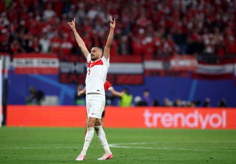 Turkey's defender #03 Merih Demiral makes a controversial hand gesture as he celebrates scoring his team's second goal during the UEFA Euro 2024 round of 16 football match between Austria and Turkey at the Leipzig Stadium in Leipzig on July 2, 2024. - Photo by AFP