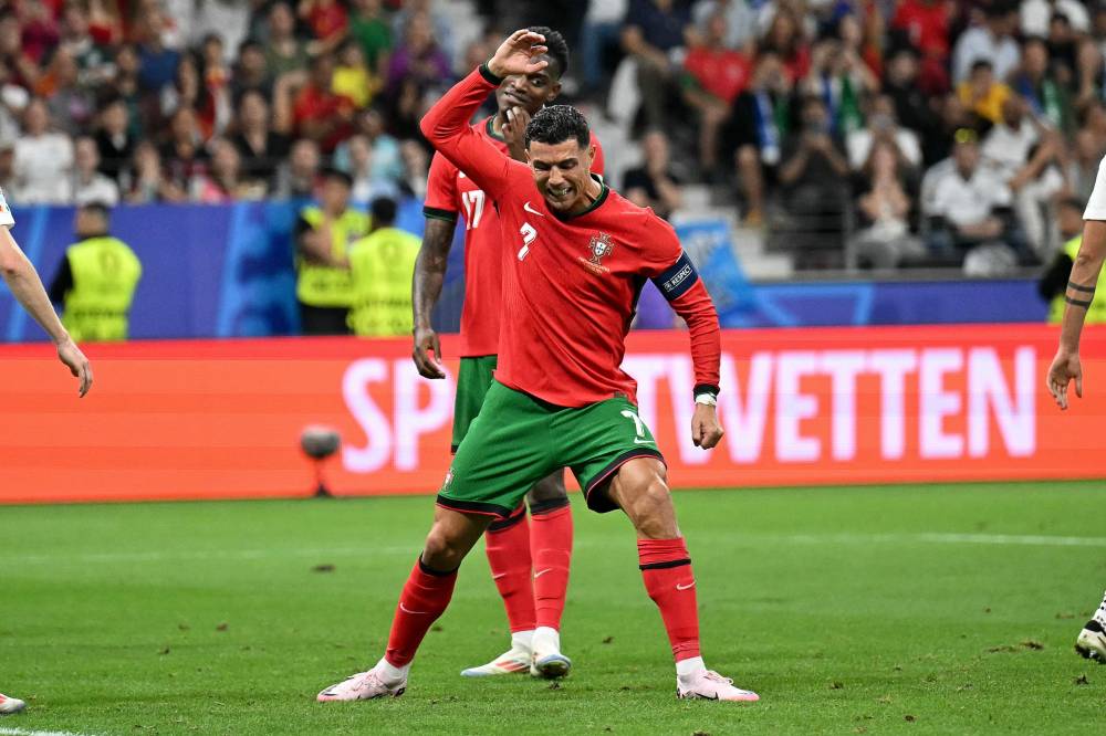 Portugal's forward #07 Cristiano Ronaldo reacts during the UEFA Euro 2024 round of 16 football match between Portugal and Slovenia at the Frankfurt Arena in Frankfurt am Main on July 1, 2024. (Photo by AFP)