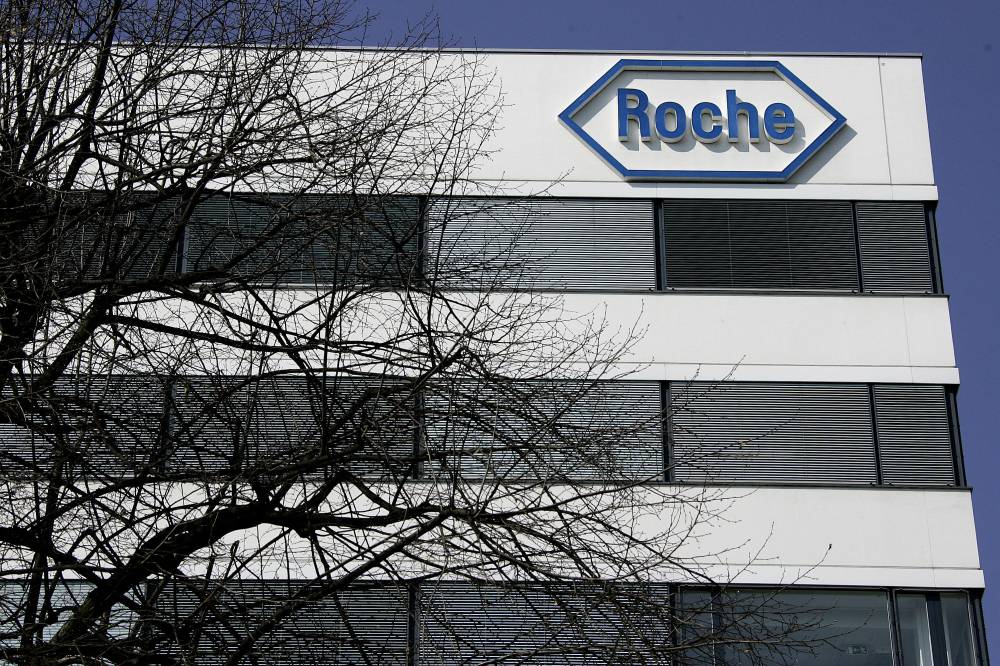 A logo of the Swiss pharmaceuticals giant Roche is seen, April 10, 2007 on a building in Basel. - (Photo by FABRICE COFFRINI / AFP)
