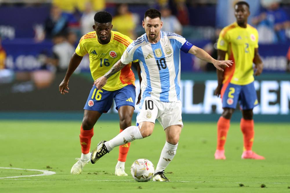 Colombia's midfielder #16 Jefferson Lerma fights for the ball with Argentina's forward #10 Lionel Messi during the Conmebol 2024 Copa America tournament final football match between Argentina and Colombia at the Hard Rock Stadium, in Miami, Florida on July 14, 2024. (Photo by AFP)