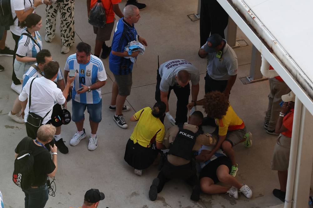 Police detain fan of Argentina prior to the CONMEBOL Copa America 2024 Final match between Argentina and Colombia at Hard Rock Stadium on July 14, 2024 in Miami Gardens, Florida. - Photo by AFP