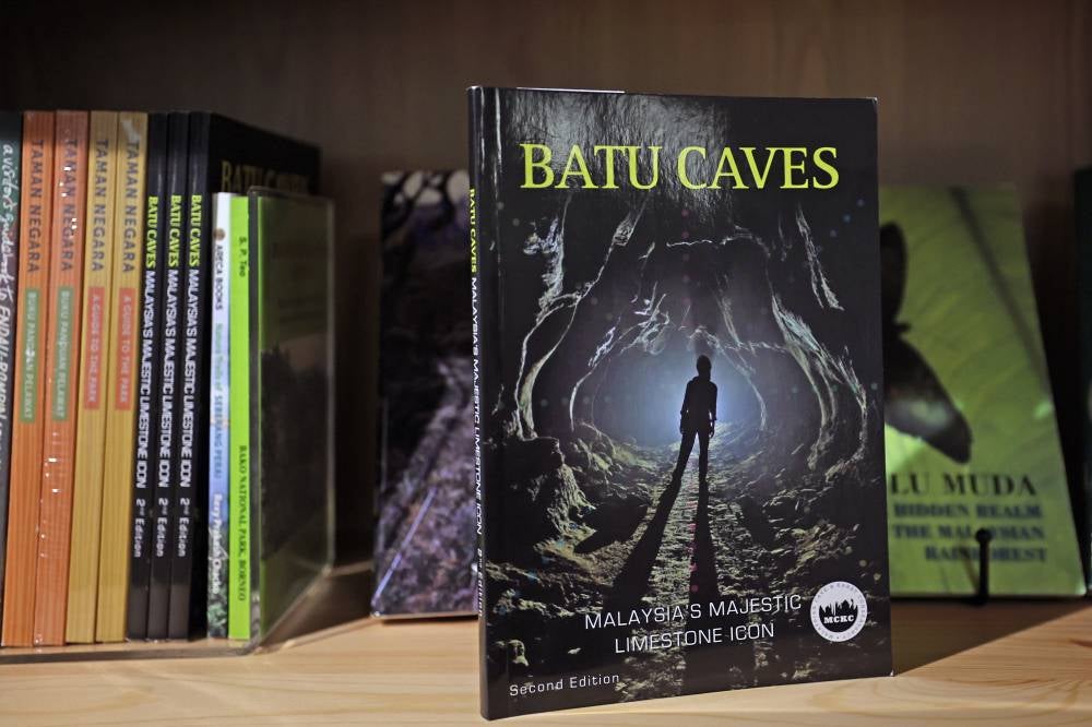 The book titled ‘Batu Caves’ is among the collection of nature-related books available at the Sunda Shelves bookstore and cafe in Damansara Kim. - Photo by Bernama
