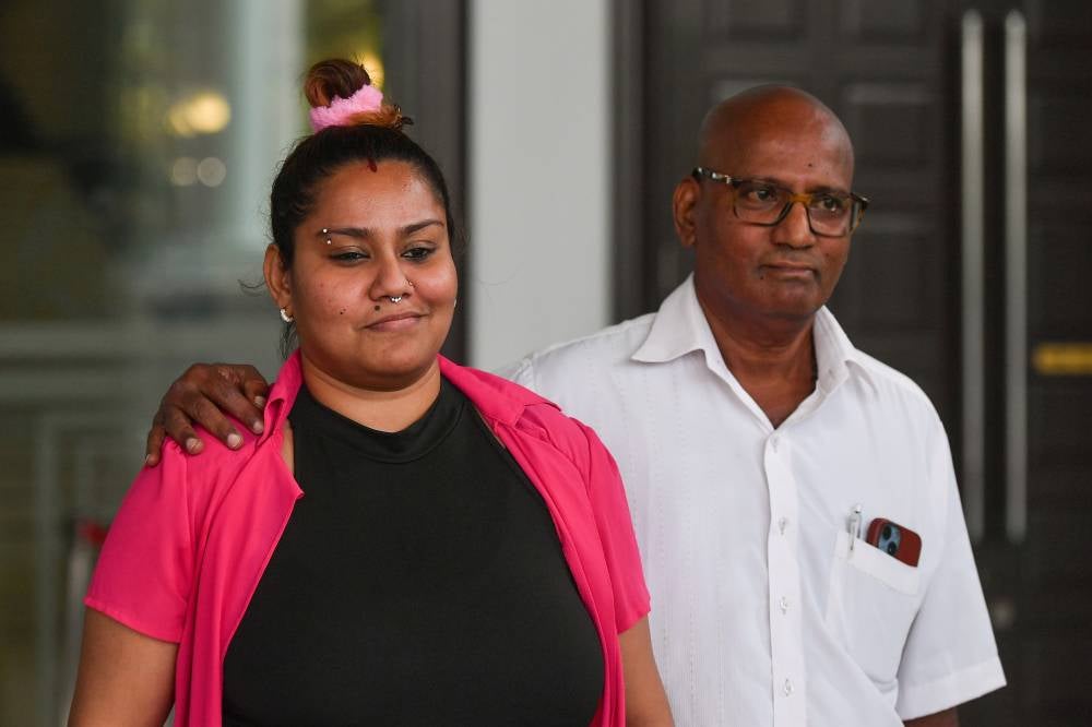 Welfare homeowner P. Shalini, 35, (left) was fined RM100 by the Magistrate’s Court after she pleaded guilty to deliberately uttering abusive words via her TikTok account "alphaquinnsha” with the intent to incite anger and disrupt peace. - Photo by Bernama