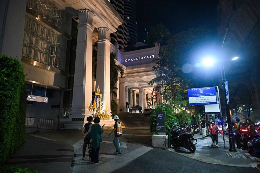 A general view of the street after an incident, in which six bodies were found at a hotel in Bangkok on July 16, 2024. (Photo by Lillian AFP)
