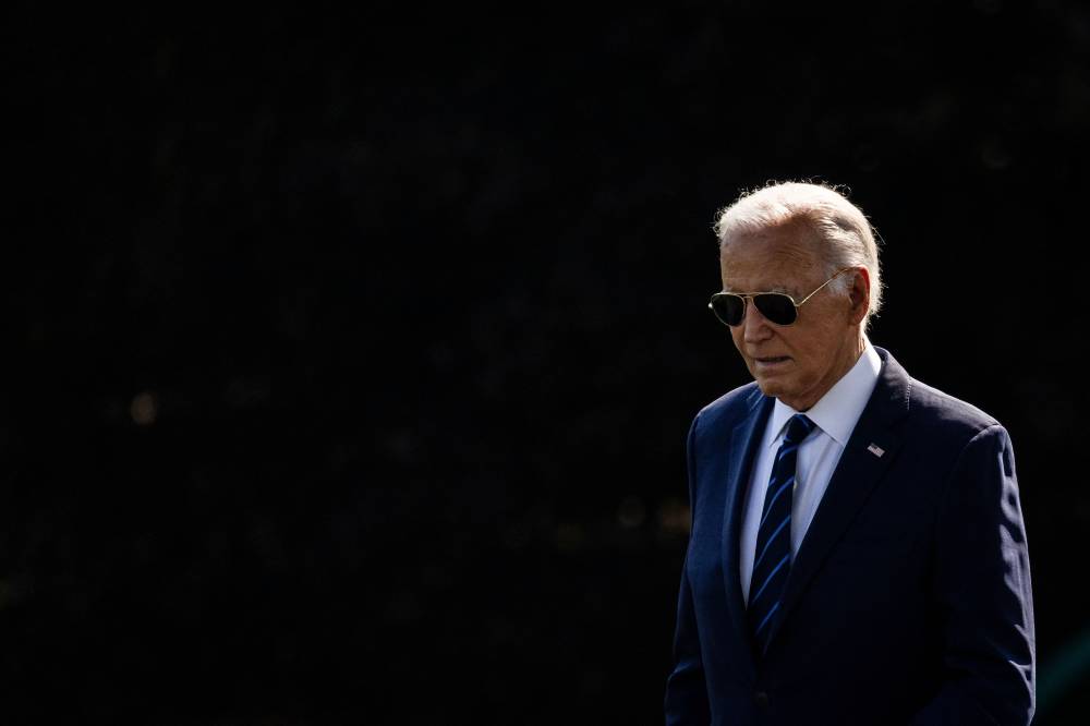 (FILES) US President Joe Biden walks out of the Oval Office towards Marine One on the South Lawn of the White House in Washington, DC, on July 15, 2024. (Photo by SAMUEL CORUM / AFP)