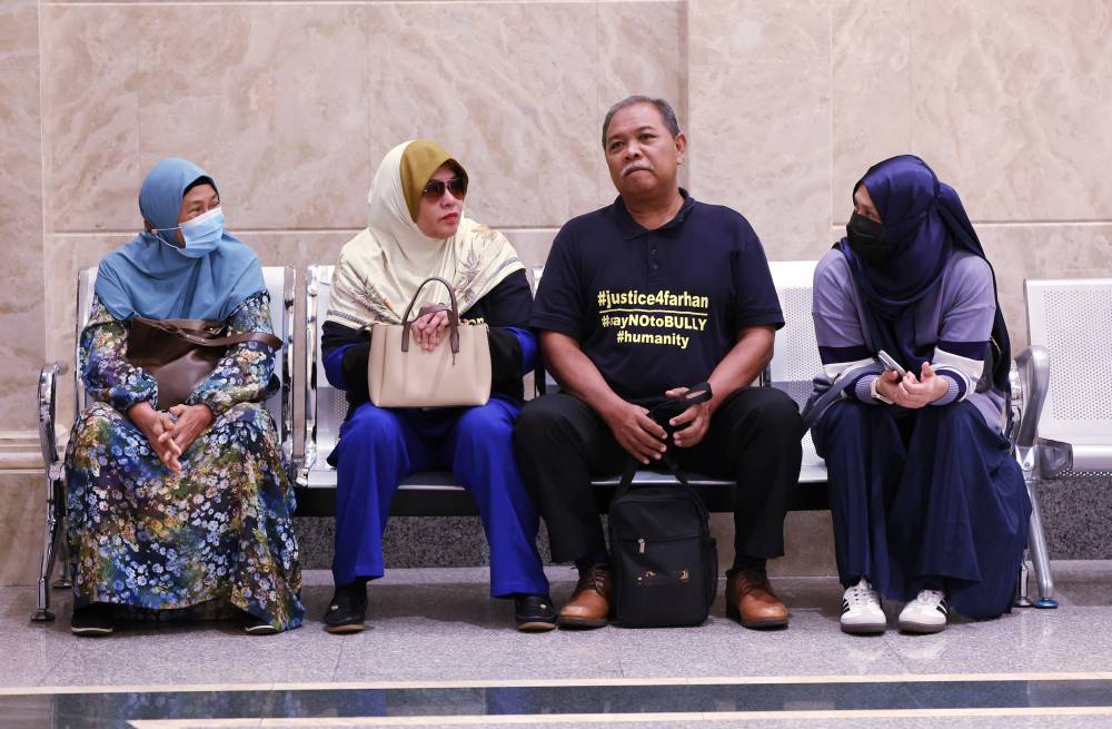 The family members of the late Zulfarhan at the Court of Appeal in Putrajaya today. - Photo by Bernama