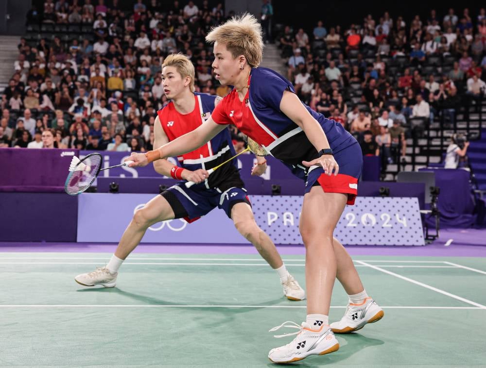 Tang Jie-Ee Wei defied all odds to defeat China’s world number two pair Feng Yan Zhe-Huang Dong Ping. - Photo by Bernama