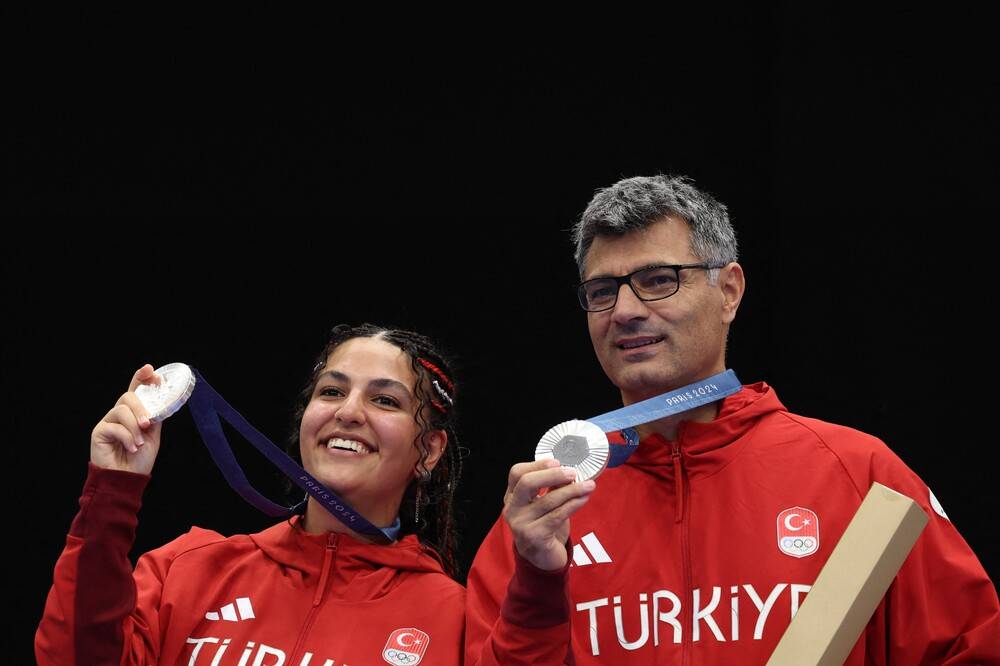 Silver medalists Turkey's Sevval Ilayda Tarhan (left), and Turkey's Yusuf Dikec pose the podium after the shooting 10m air pistol mixed team gold medal match during the Paris 2024 Olympic Games at Chateauroux Shooting Centre on July 30. (Photo by ALAIN JOCARD / AFP)